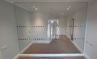 COVID-secure clear toughened glass visitor room.